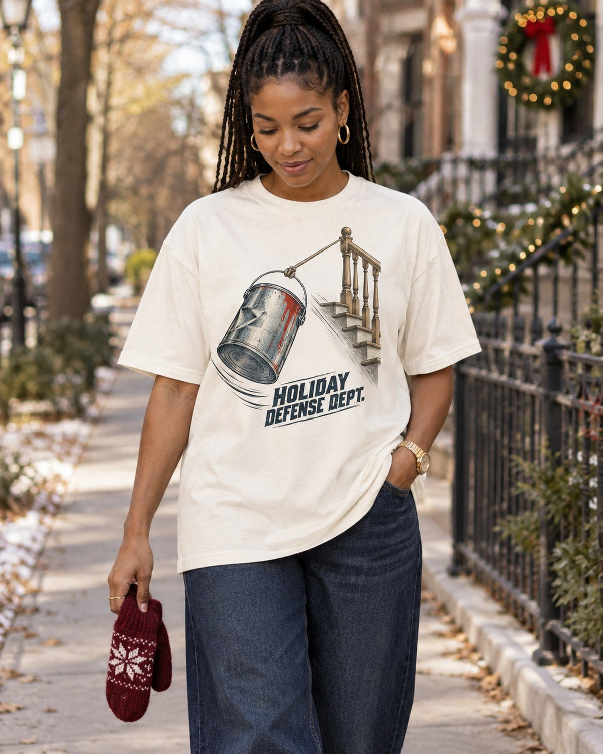 Holiday Defense Dept Paint Can Christmas T-Shirt, worn by a model