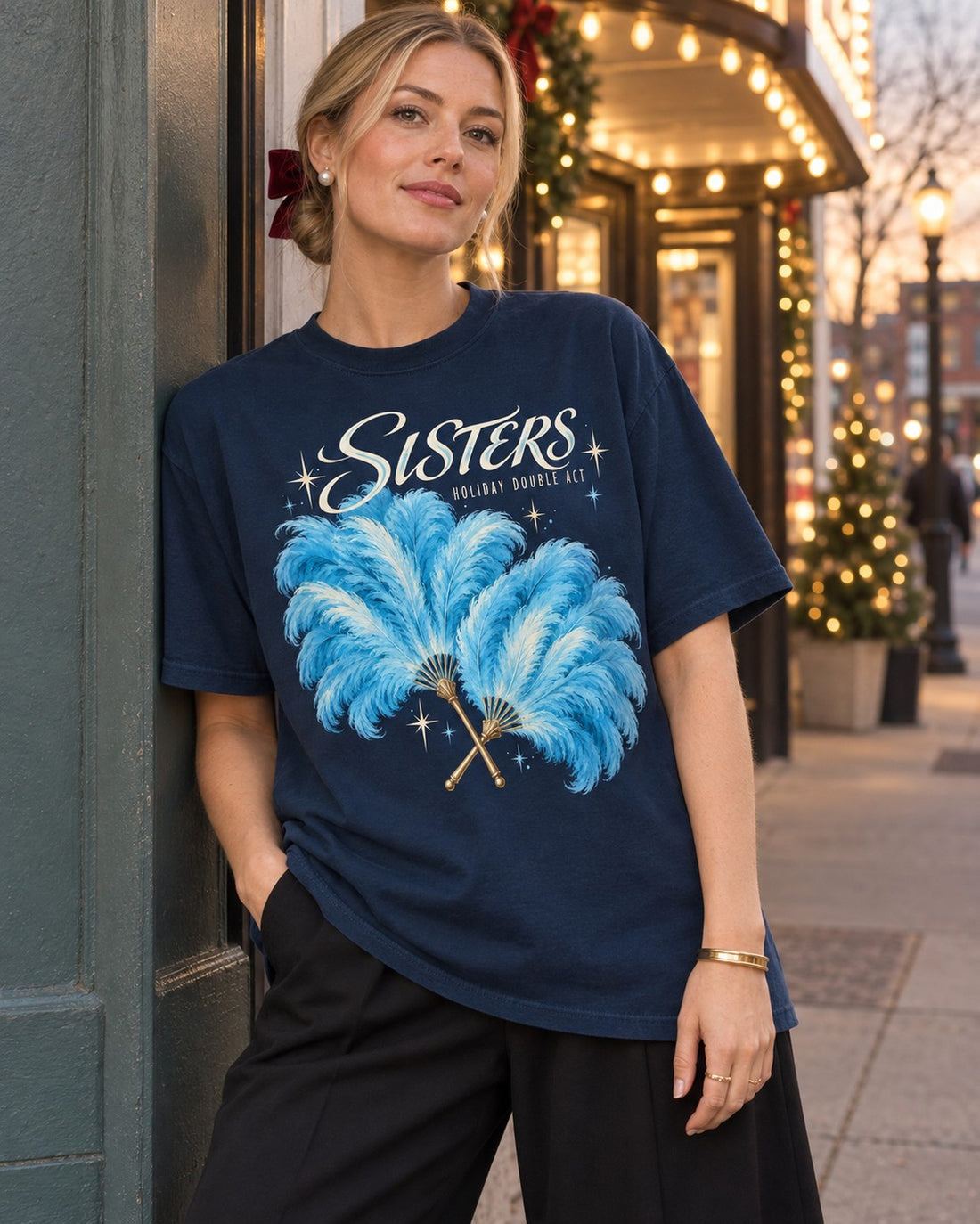 Sisters Holiday Double Act Feather Fan T-Shirt, worn by a model