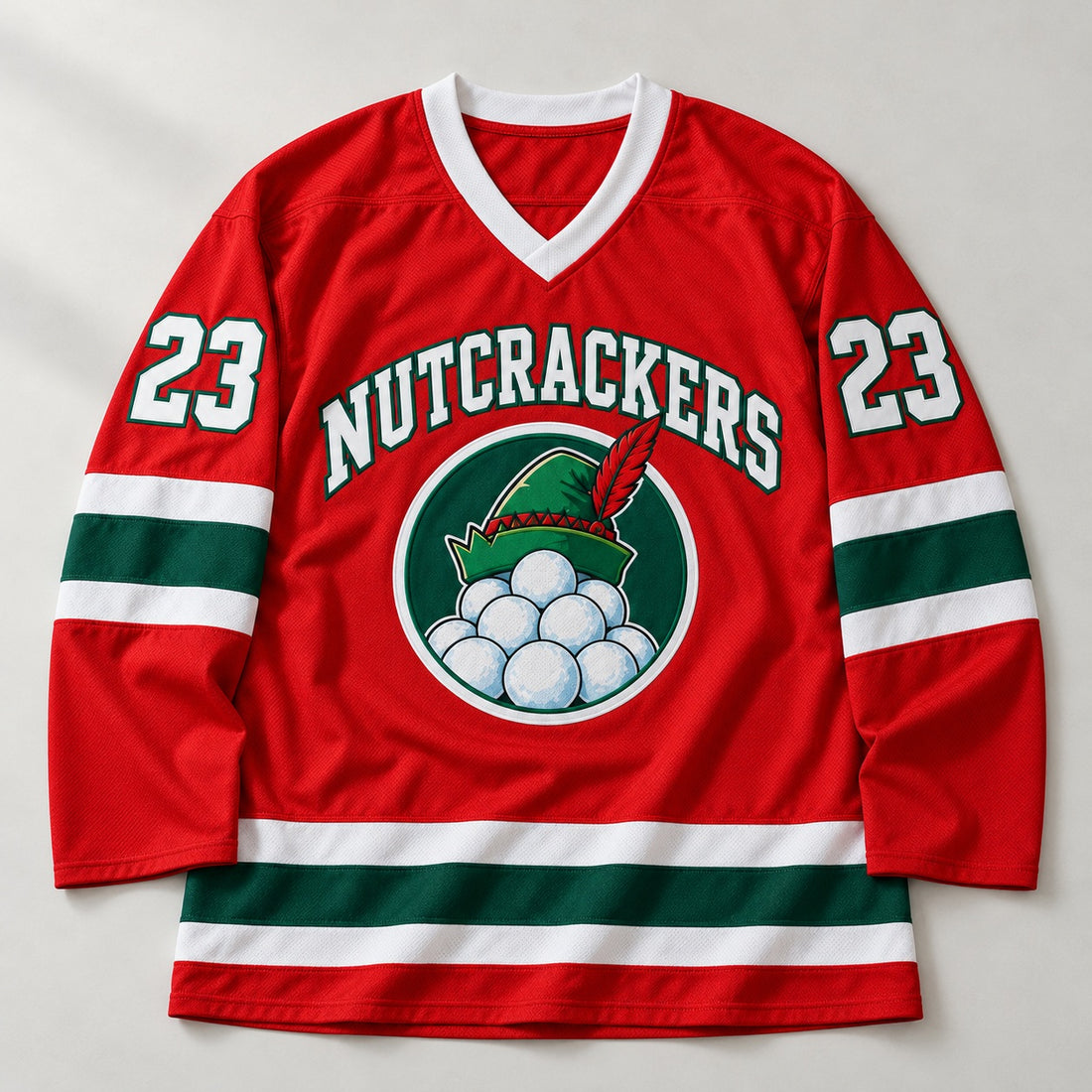 Red Christmas hockey jersey with NUTCRACKERS lettering, an elf hat and snowball badge and number 23 on the sleeves, laid flat