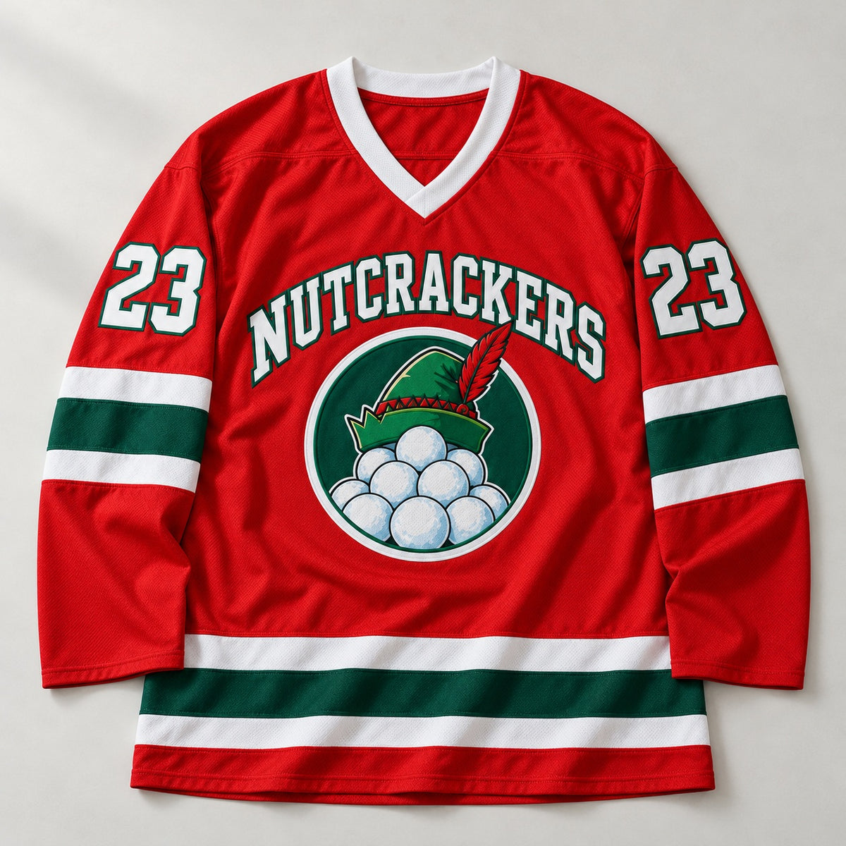 Red Christmas hockey jersey with NUTCRACKERS lettering, an elf hat and snowball badge and number 23 on the sleeves, laid flat