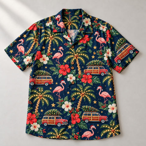Christmas Hawaiian shirt with flamingos in Santa hats, lit palm trees and wood-paneled wagons carrying trees, laid flat