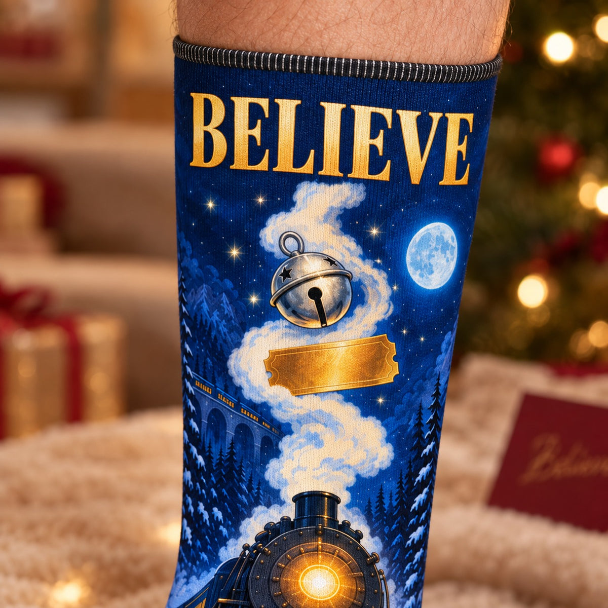 Close-up of the printed sock: Believe Golden Ticket Christmas Crew Socks