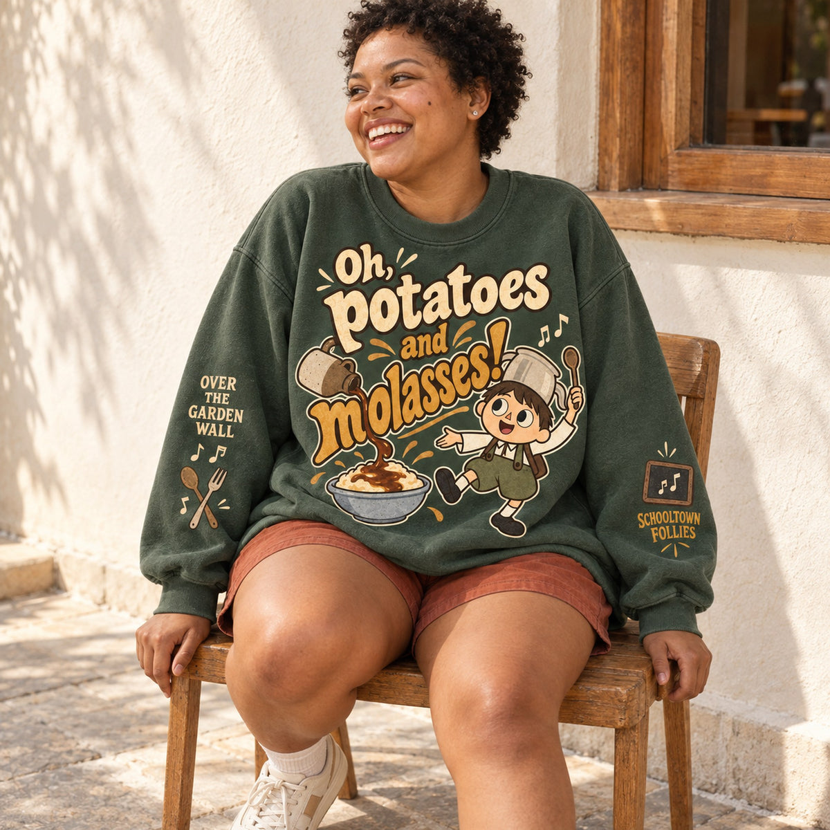Potatoes and Molasses sweatshirt seated