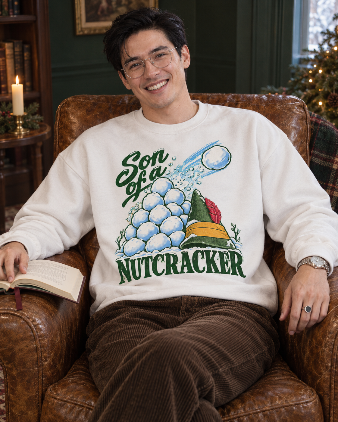 Son of a Nutcracker Christmas sweatshirt, white crewneck, indoors