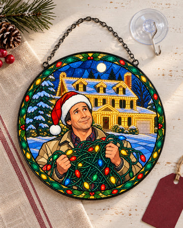 Stained glass suncatcher laid flat with its chain: Tangled Christmas Lights Stained Glass Suncatcher