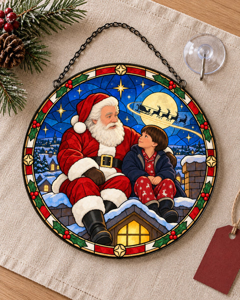 Stained glass suncatcher laid flat with its chain: Santa on the Rooftop Stained Glass Suncatcher